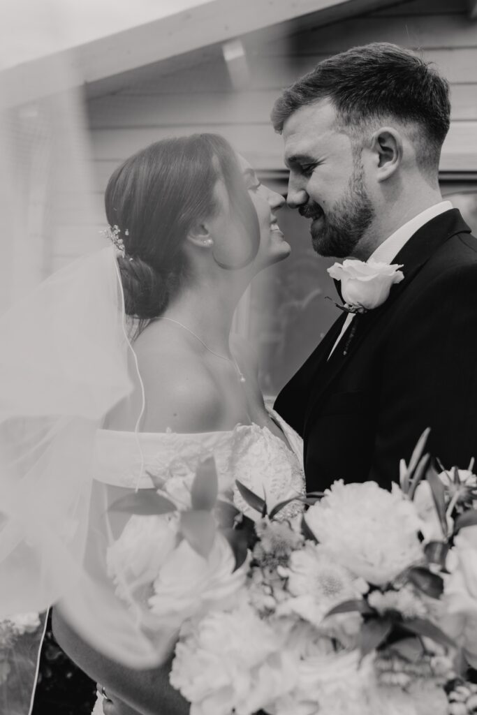 A couple having their day wedding portraits at Easton Grange in Suffolk