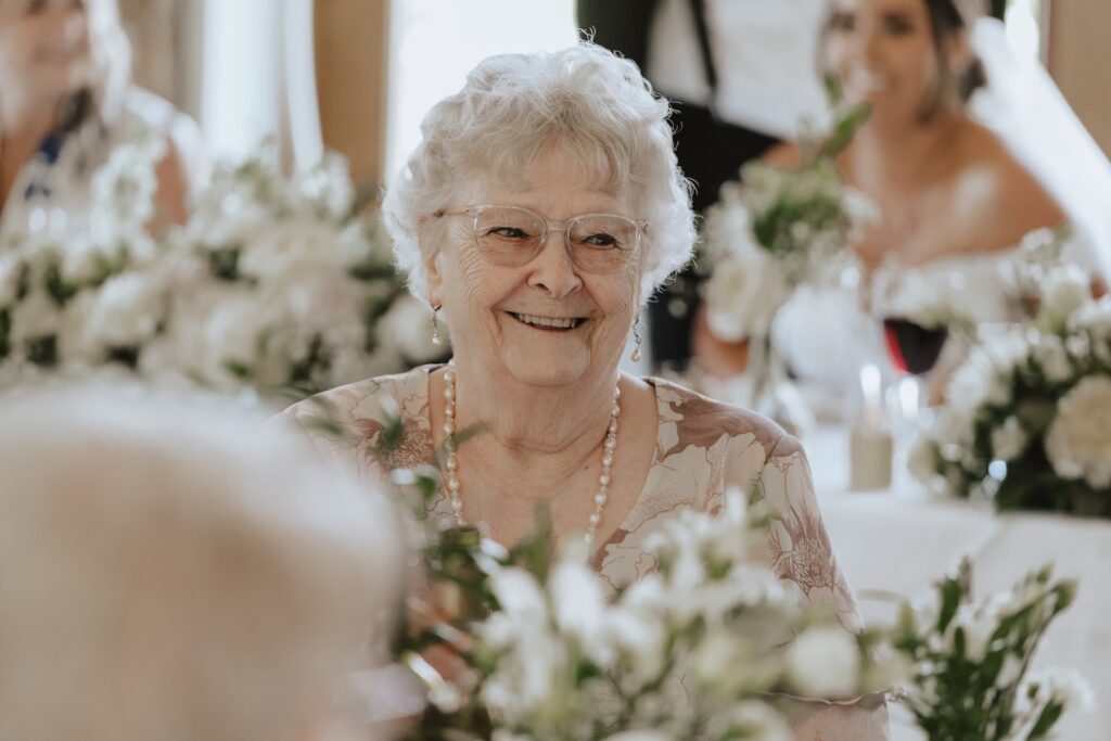 Suffolk wedding photographer capturing candids during speeches at Easton Grange