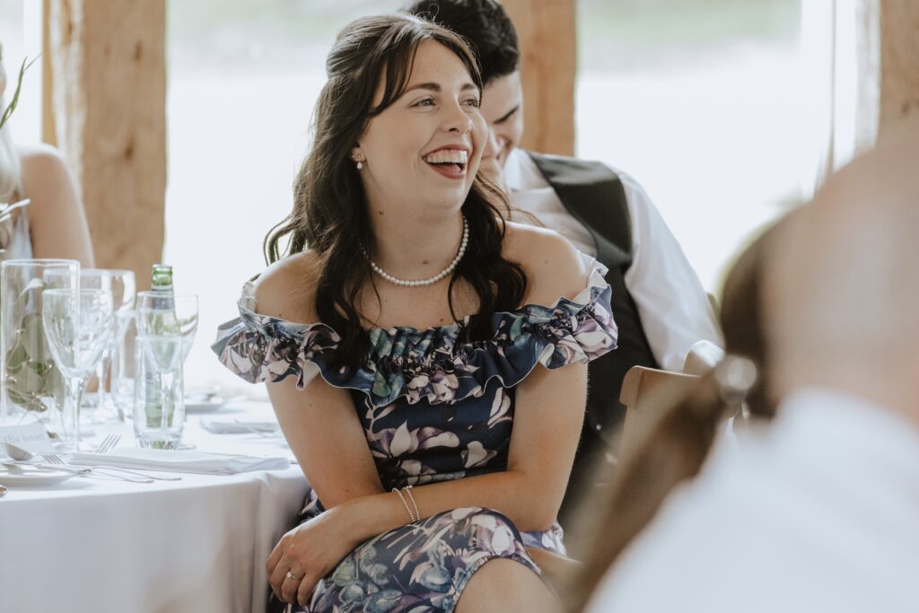 Easton Grange wedding photographer capturing candids during speeches in Suffolk