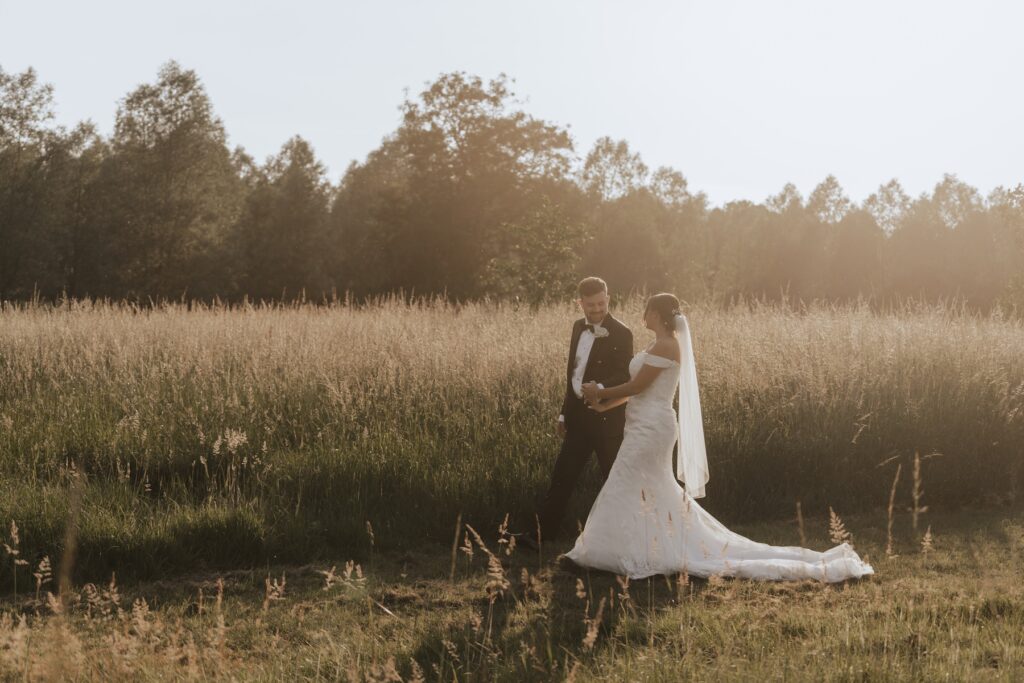 Evening portraits at golden hour of a couple at Easton Grange in Suffolk