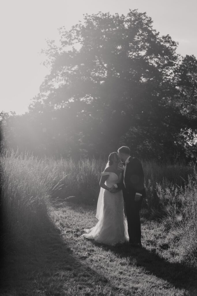 Suffolk wedding photographer capturing evening portraits at Easton Grange