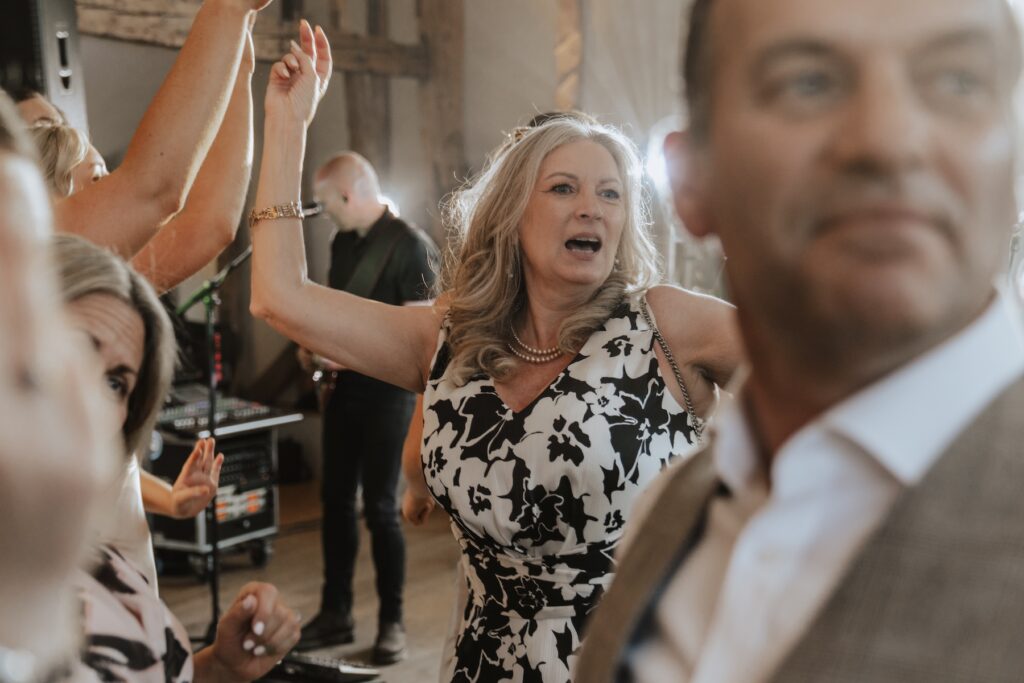 Guests dancing on the dance floor at Easton Grange during a Suffolk wedding