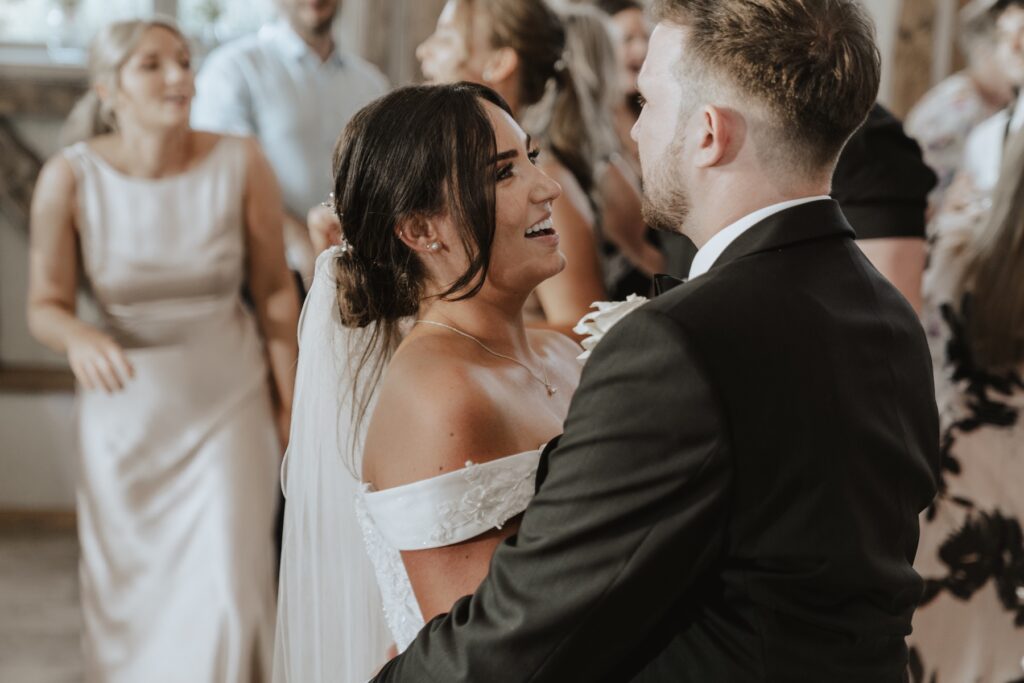 A bride dancing on the dance floor at Easton Grange during a Suffolk wedding