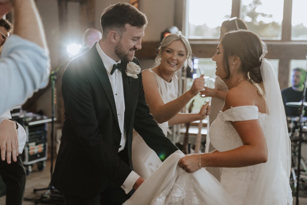 The bride and groom dancing on the dance floor at Easton Grange during a Suffolk wedding