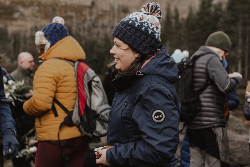 Candid moments of guests in the Cairngorms after a Scottish elopement ceremony