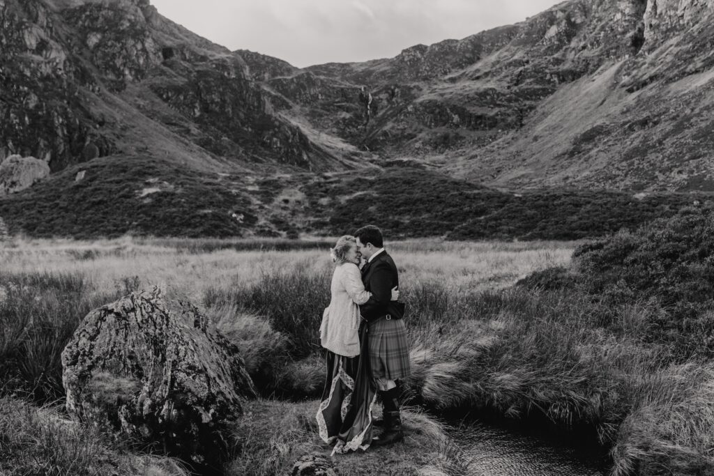 A couple having an adventurous Scotland elopement at Corrie Fee in the cairngorms