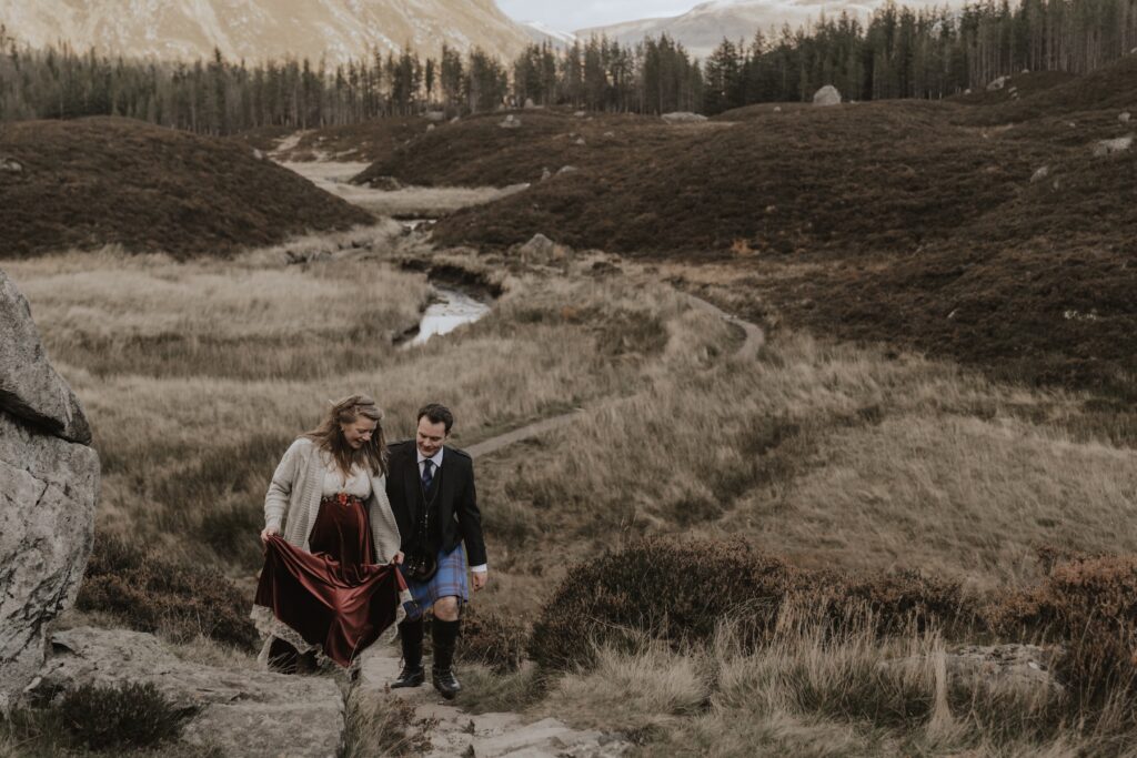 A couple exploring Corrie Fee during their Scottish elopement