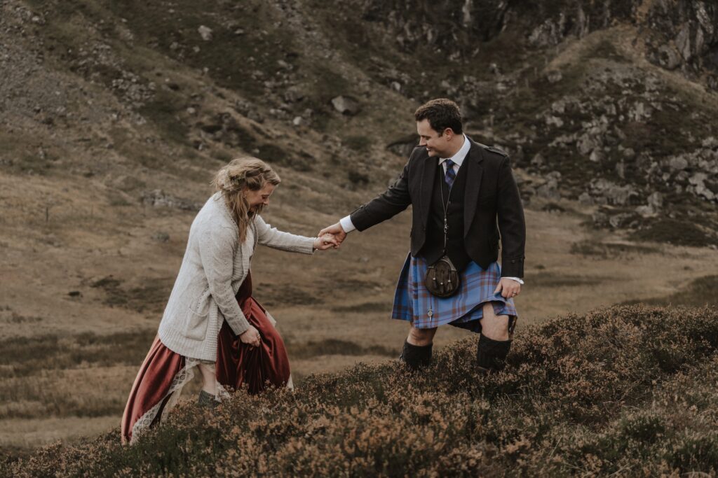 A couple during their adventurous elopement in Scotland