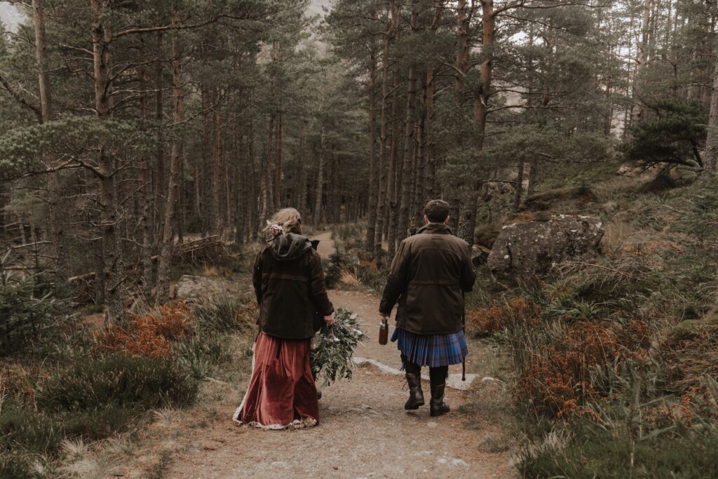 A couple hiking in the cairngorms during their Scotland elopement