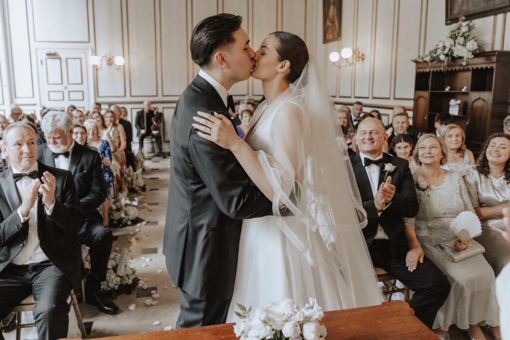 The first kiss during the ceremony at Gosfield Hall