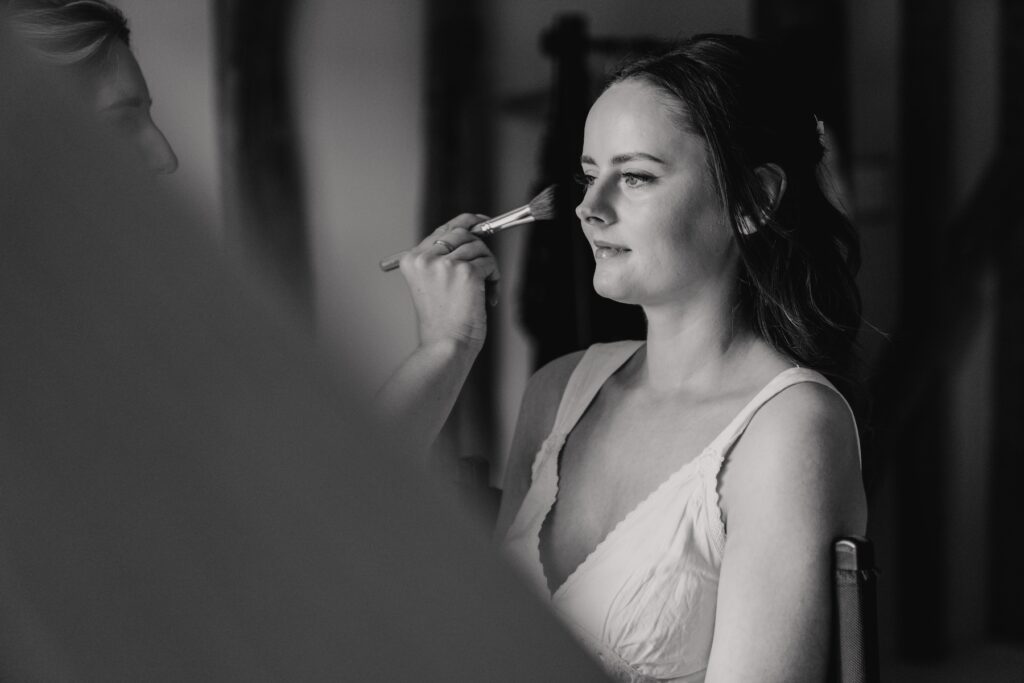 Bride getting ready in refurbished house at Copdock Hall, Suffolk wedding morning