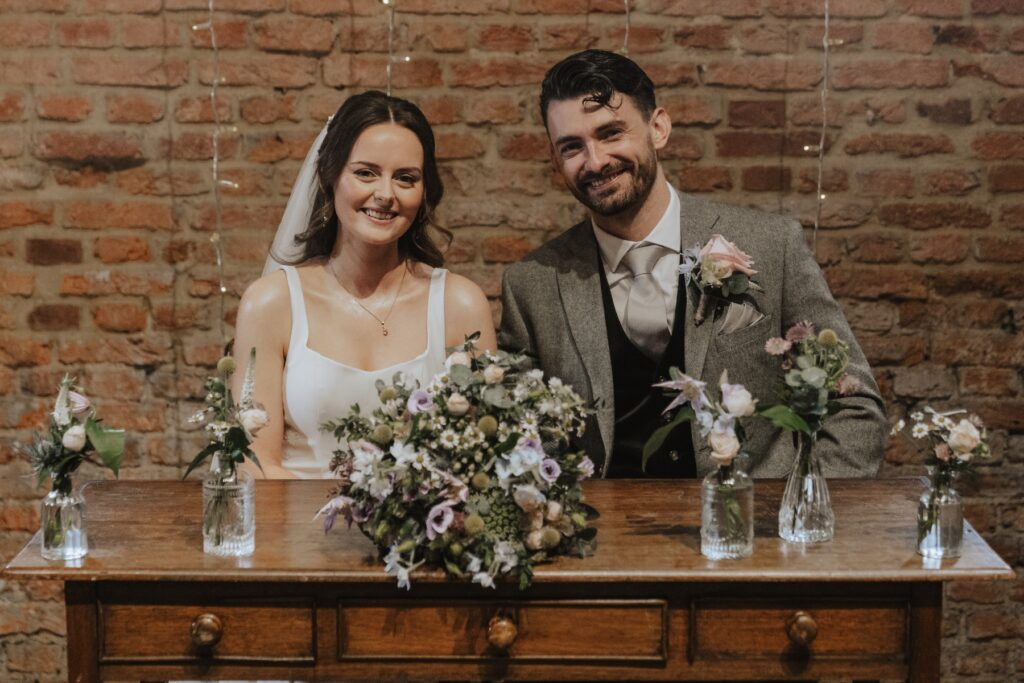 Ethan’s father giving religious blessing after ceremony at Copdock Hall wedding