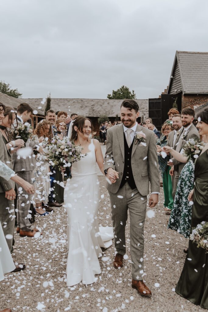 Confetti moment captured by Suffolk wedding photographer at Copdock Hall wedding