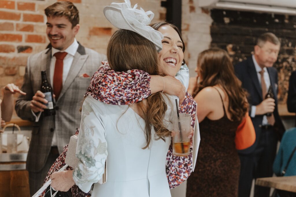 Natural candid wedding photography during outdoor reception at Copdock Hall Suffolk