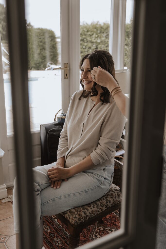 Bride getting ready in house at Godwick Hall, Norfolk wedding morning in Norfolk