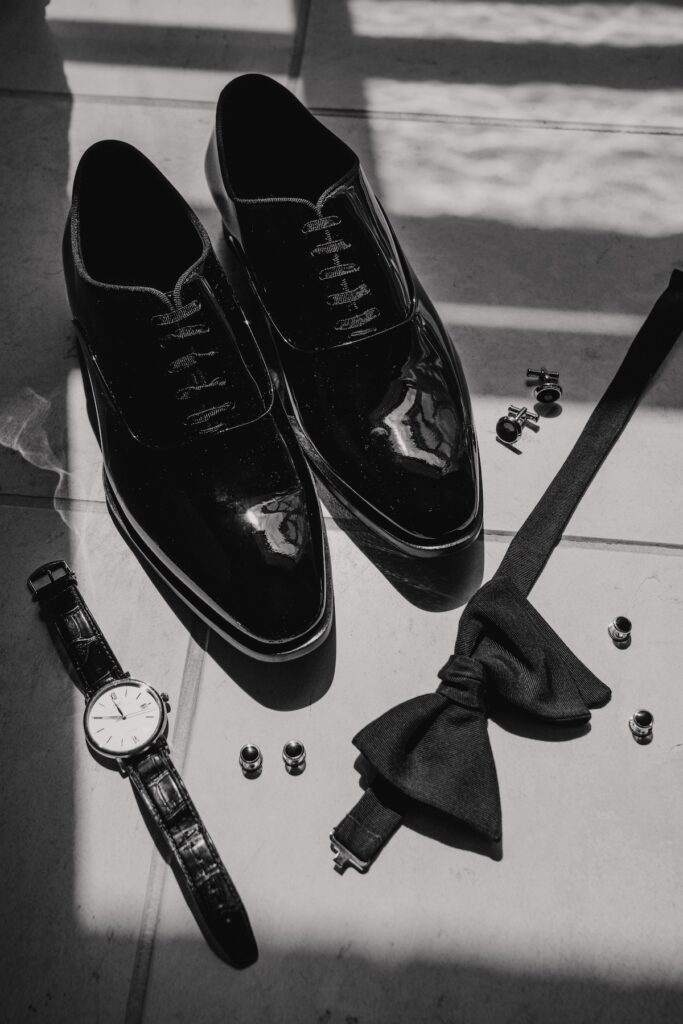 Black tie groom prep captured by Norfolk wedding photographer at Godwick Hall