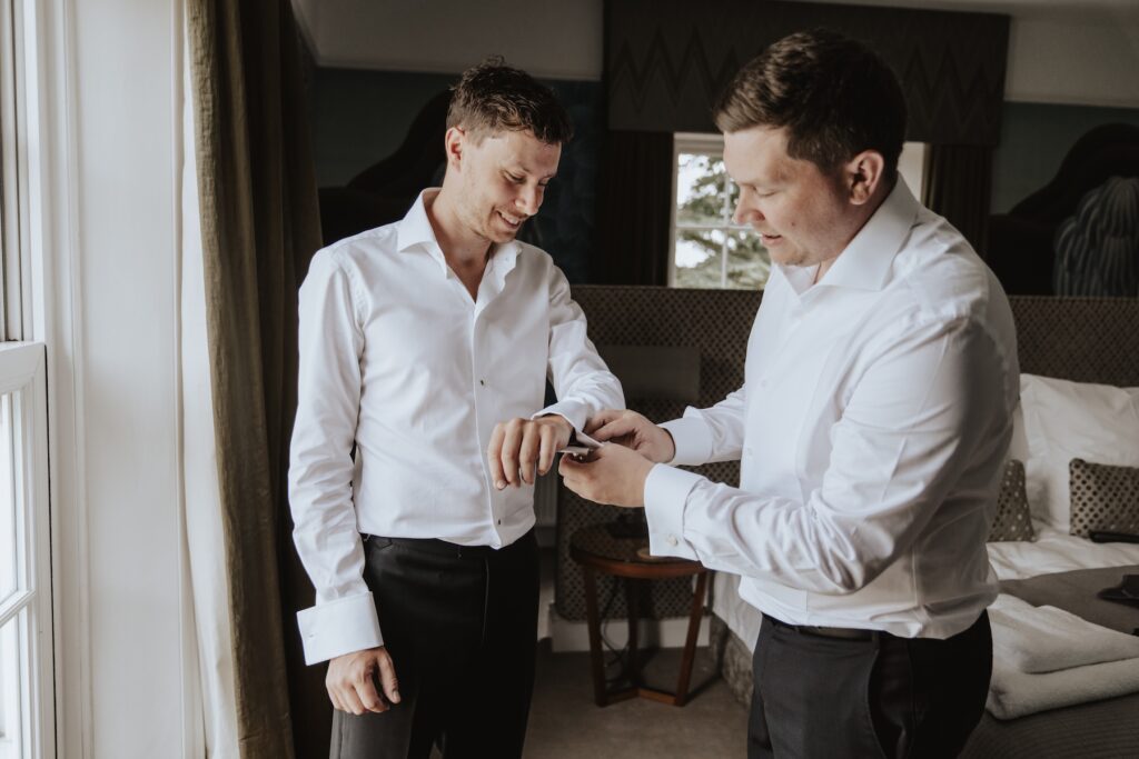 Candid laughter during morning preparations at Godwick Hall Norfolk