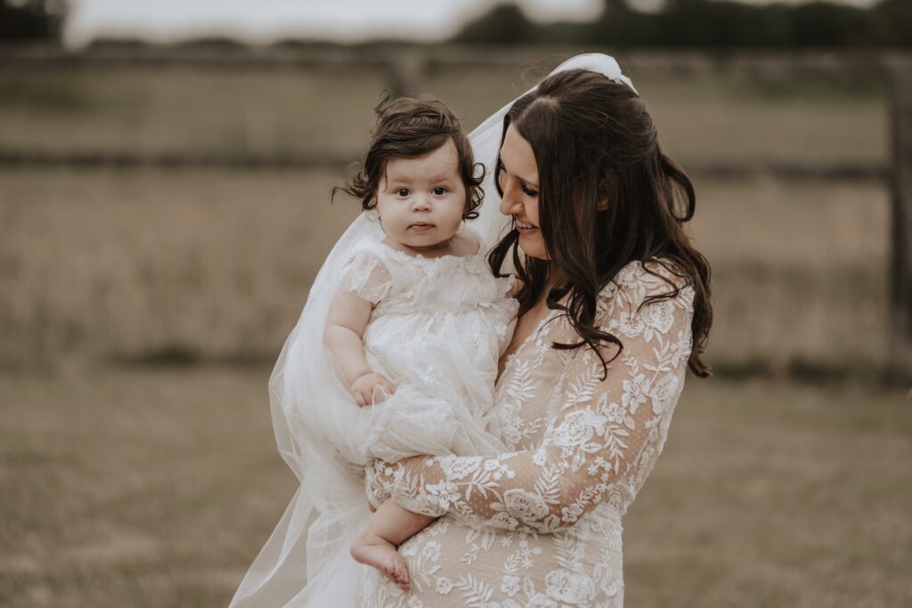 Guests mingling in gardens during Godwick Hall drinks reception