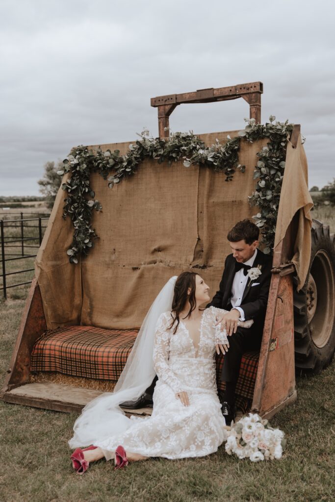 Norfolk wedding photographer capturing couples portraits on the tractor