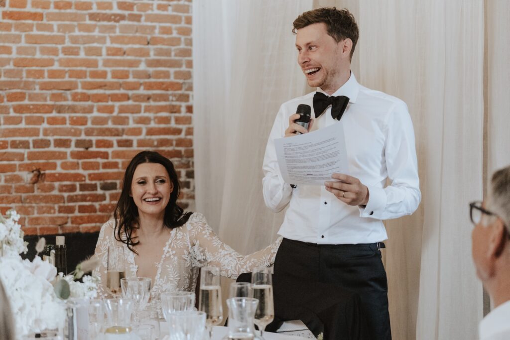 Guests raising glasses during speeches at Godwick Hall Norfolk