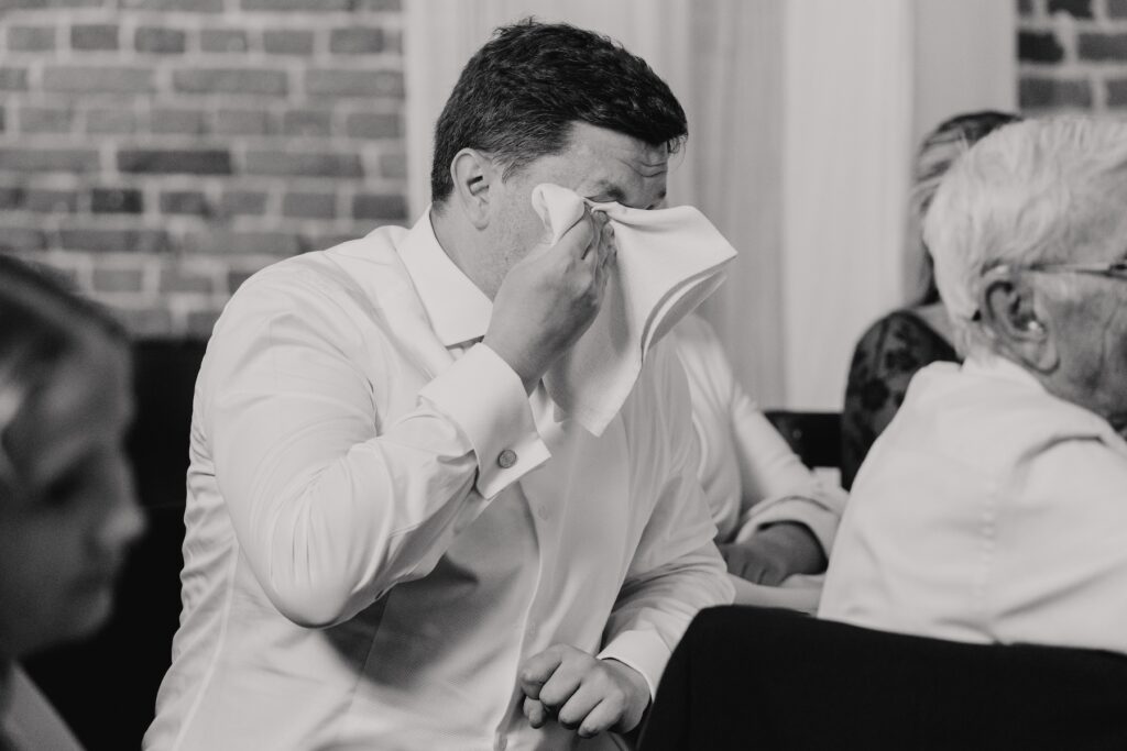 Guests crying at speeches at Godwick Hall by Norfolk wedding photographer