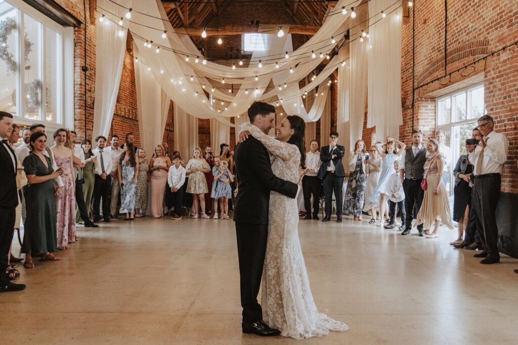 First dance in Great Barn under fairy lights, Norfolk wedding photographer