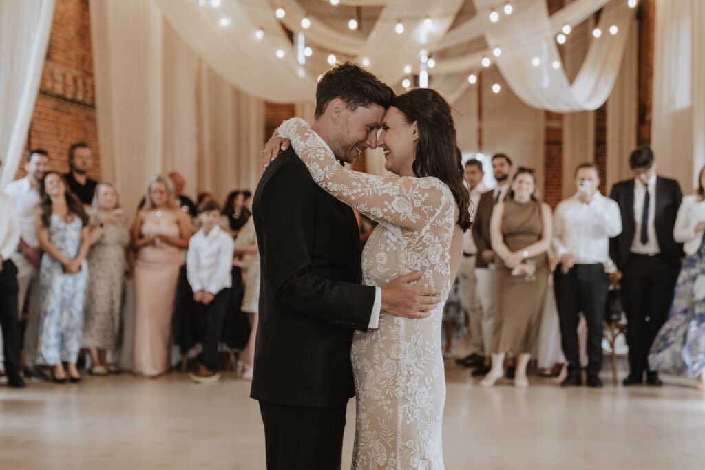 Candid laughter on dancefloor at Godwick Hall evening reception