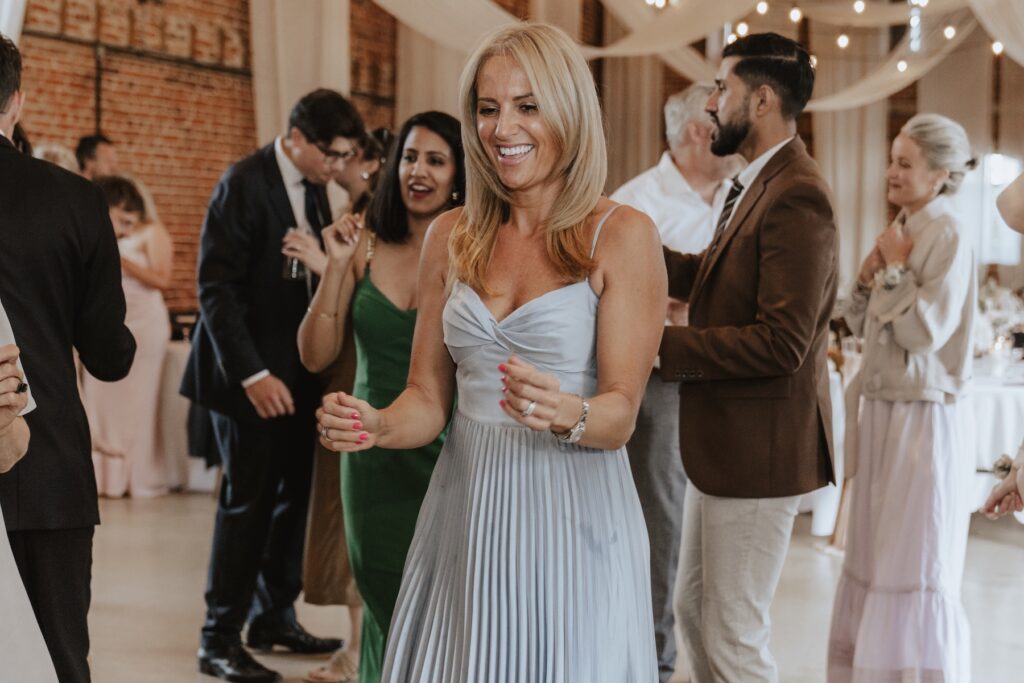 Guests dancing and celebrating during Godwick Hall wedding party