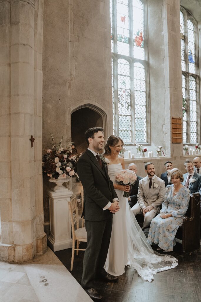 Suffolk wedding photographer capturing the bride and groom during their ceremony