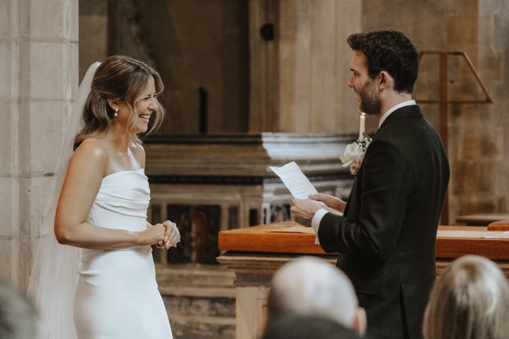 Close-up of couple holding hands during the ceremony