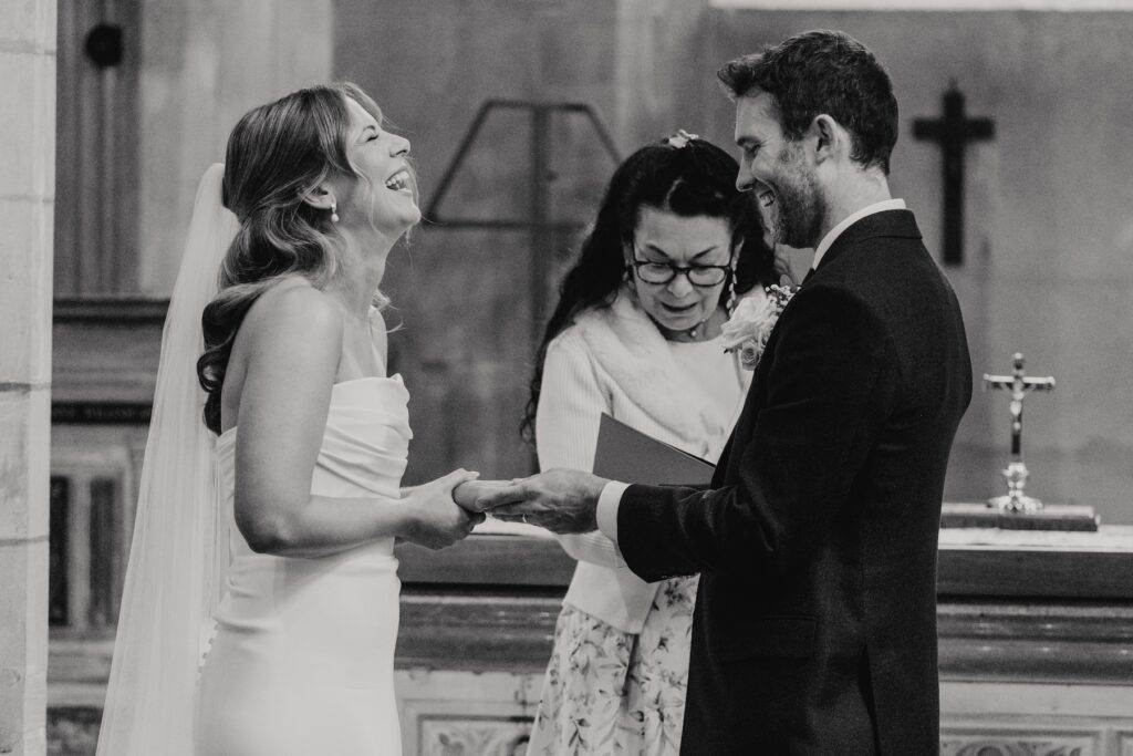 Bride wiping away a tear during handwritten vows