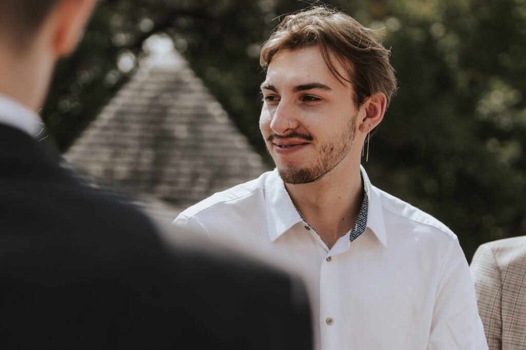 Essex wedding photographer capturing guest candids outside the church