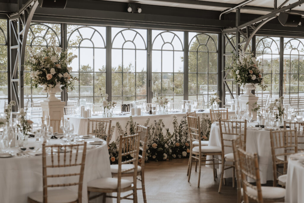 Orangery at High House beautifully decorated with florals and soft draping