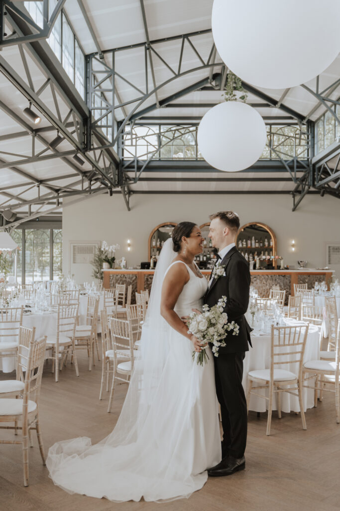 Couples portrait in the orangery at high house by Essex wedding photographer