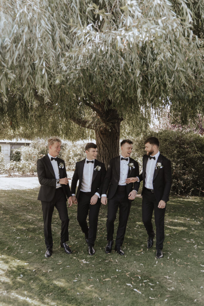 Groomsmen portraits outside High House wedding venue in Essex