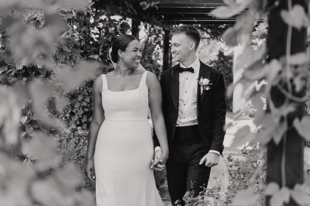 High House wedding venue with bride and groom walking towards the camera