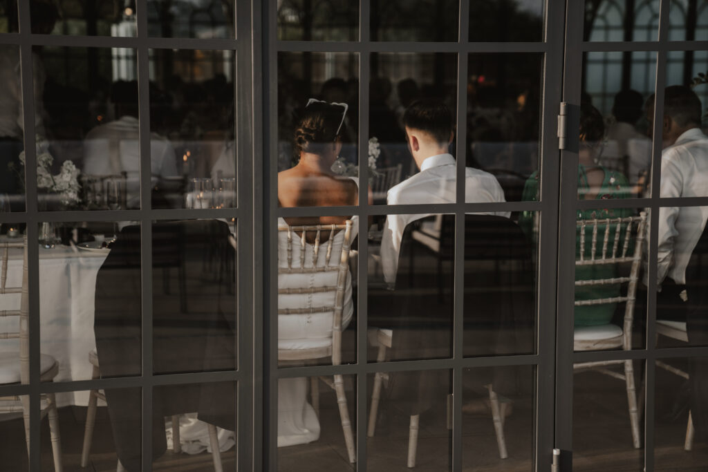 In between moments in the orangery at High House during a wedding