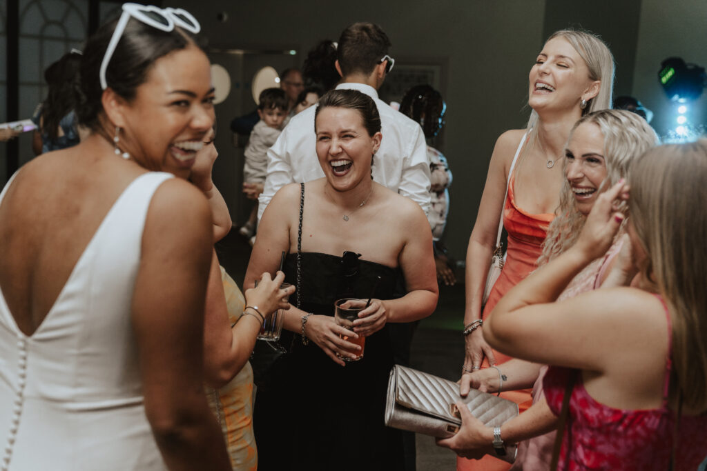 Candid photos of guests on the dance floor during High House wedding