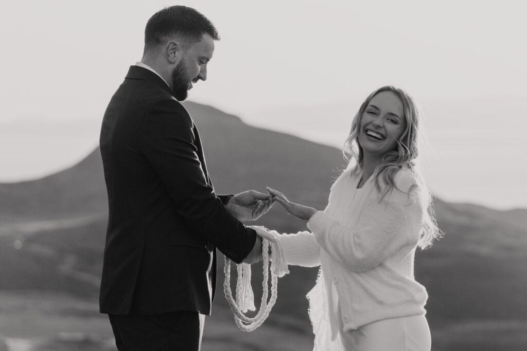 Couple laughing during emotional Isle of Skye elopement vows