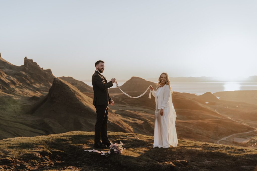Intimate elopement ceremony at Quiraing led by celebrant with mountain backdrop
