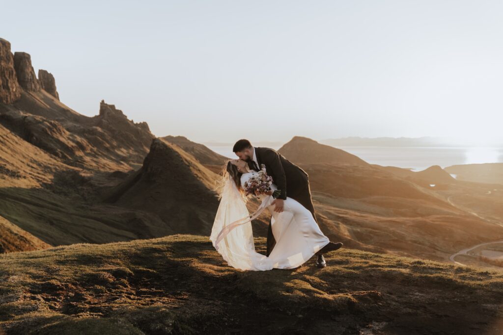 Elopement portraits overlooking the Quiraing winding road on the Isle of Skye