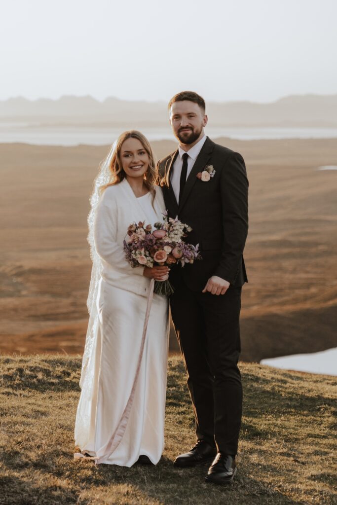A couple having just eloped at Quiraing on the Isle of Skye in Scotland