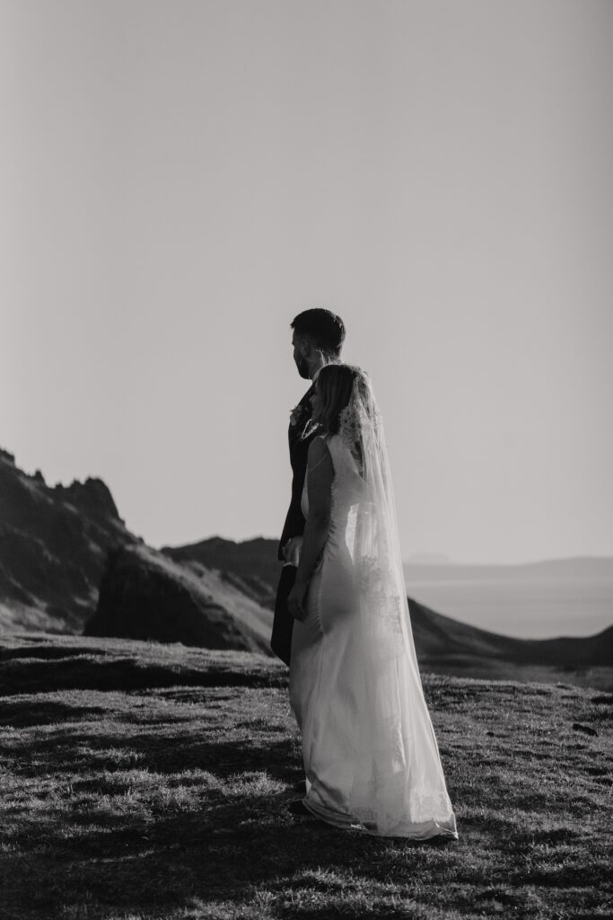 A couple eloping during sunrise on the Isle of Skye captured by an elopement photographer in Scotland