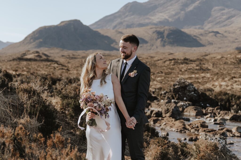 Scotland elopement couple enjoying peaceful mountain views at Sligachan