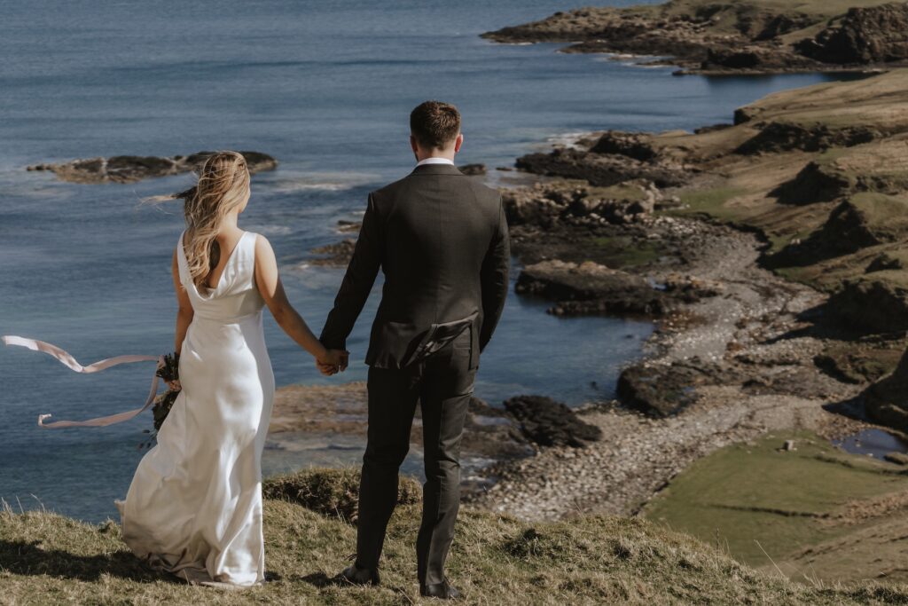 Elopement celebration on the Isle of Skye with golden hour light and sea views
