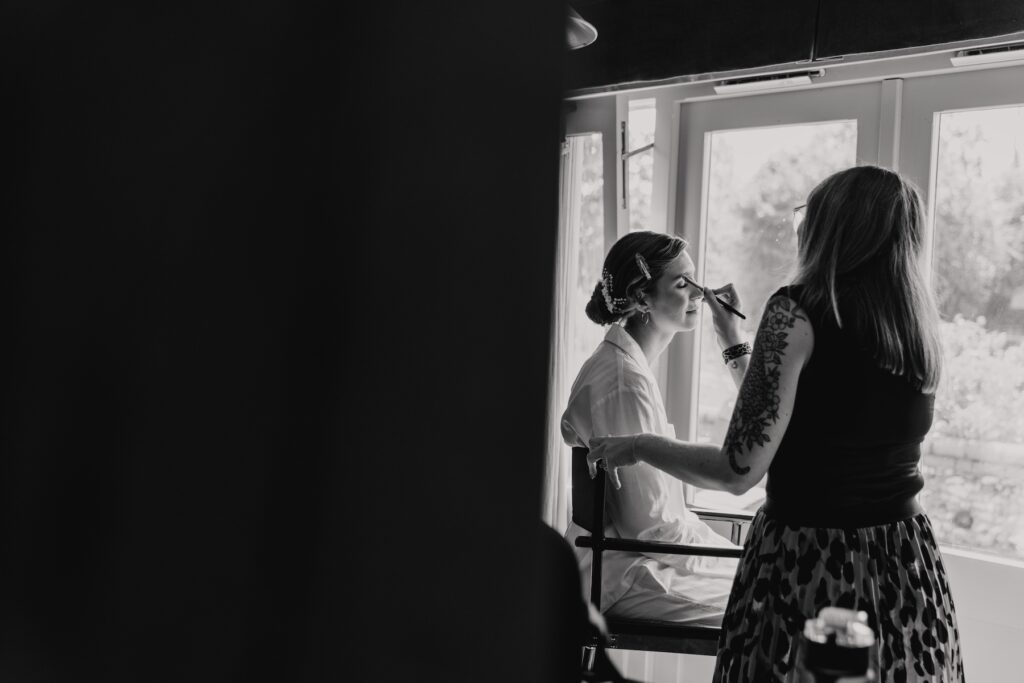Bride getting ready at Retreat East in Suffolk, captured by a Suffolk wedding photographer