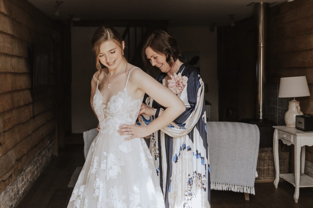 Lucie smiling with bridesmaids at Retreat East before her Jimmy’s Farm wedding