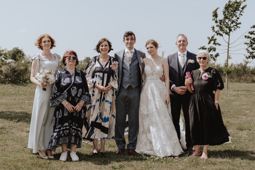 Family photos taken with countryside views at Jimmy’s Farm wedding
