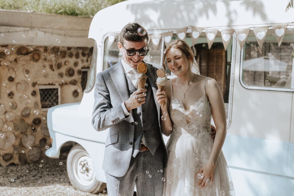 Couple enjoying personalised ice cream truck at Jimmy’s Farm wedding