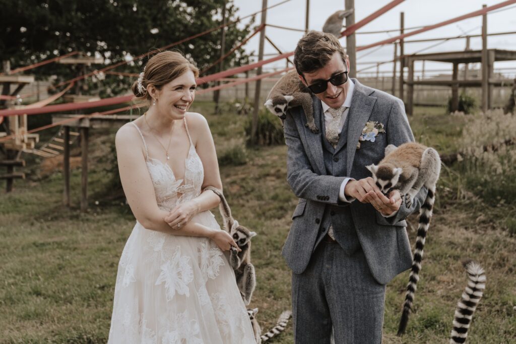 Bride and groom meeting lemurs during Jimmy’s Farm wedding experience